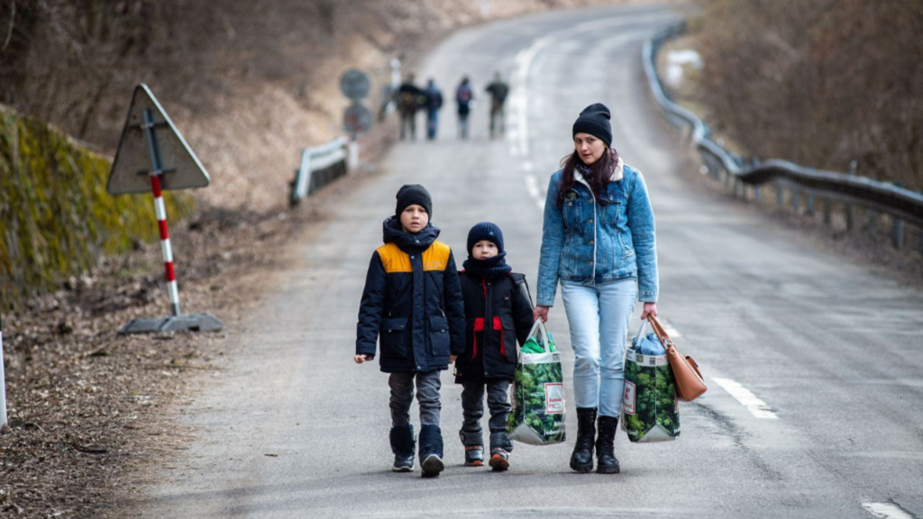 Ukrainian refugees, including women and children, fleeing conflict zones in the Russia-Ukraine war in search of safety.