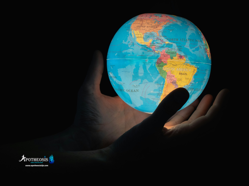 Hands holding a glowing world globe representing global responsibility and the role of Carbon Markets in climate action.