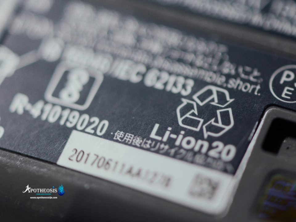 Close‑up of a lithium‑ion battery label showing certification marks and recycling symbols related to Battery Recycling.