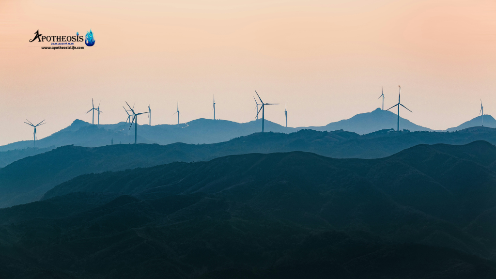 Wind turbines on mountain ridges at sunset showing renewable energy infrastructure linked to Critical Mineral demand.